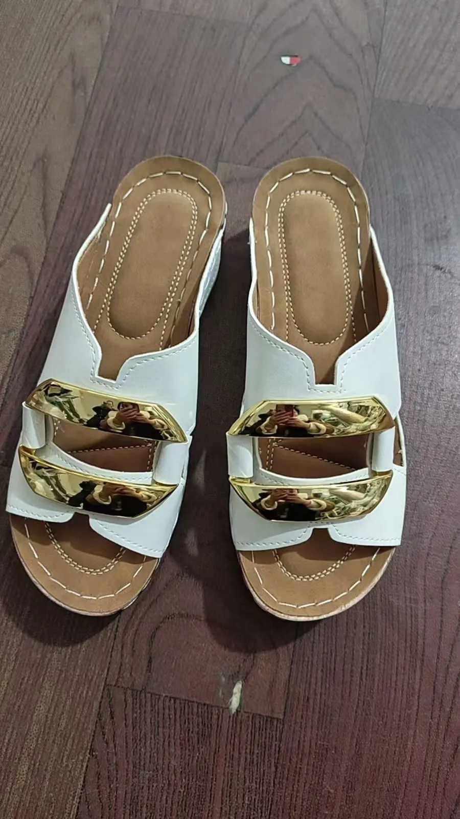 Roman style platform flip-flop sandals in a solid colour on a white background.
