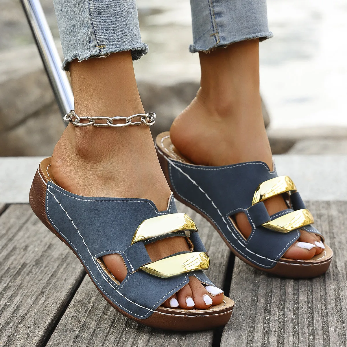 Roman style platform flip-flop sandals in a solid colour on a white background.