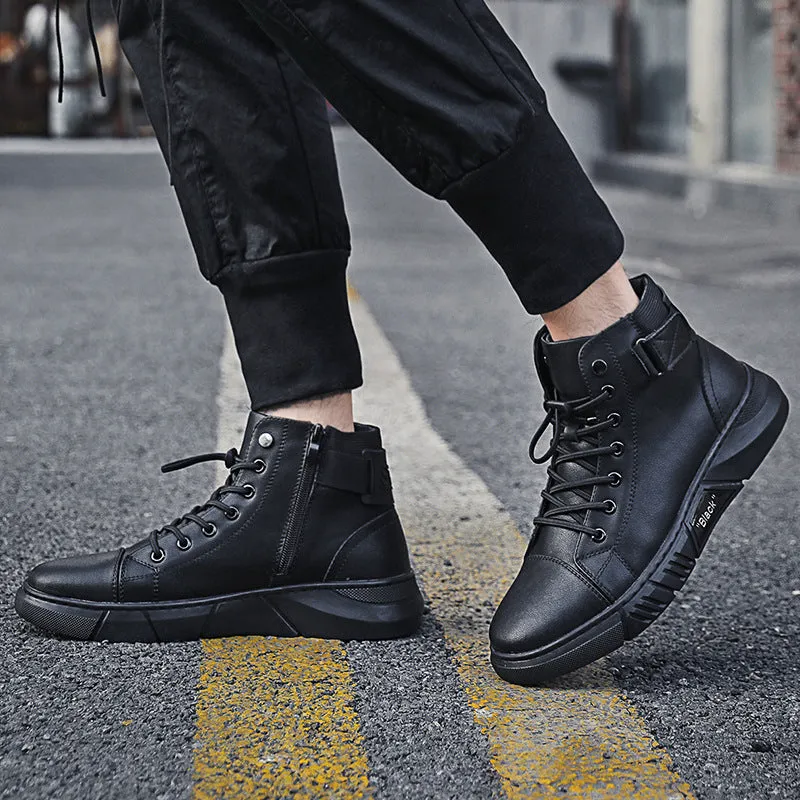 Black high-top men's leather boots with cotton lining and rubber sole on wooden floor
