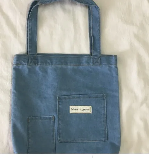 Shoulder bag with soft handle and inner patch pocket available in multiple colours including dark blue