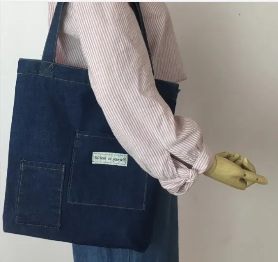 Shoulder bag with soft handle and inner patch pocket available in multiple colours including dark blue