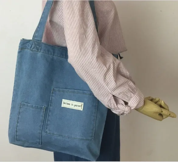 Shoulder bag with soft handle and inner patch pocket available in multiple colours including dark blue