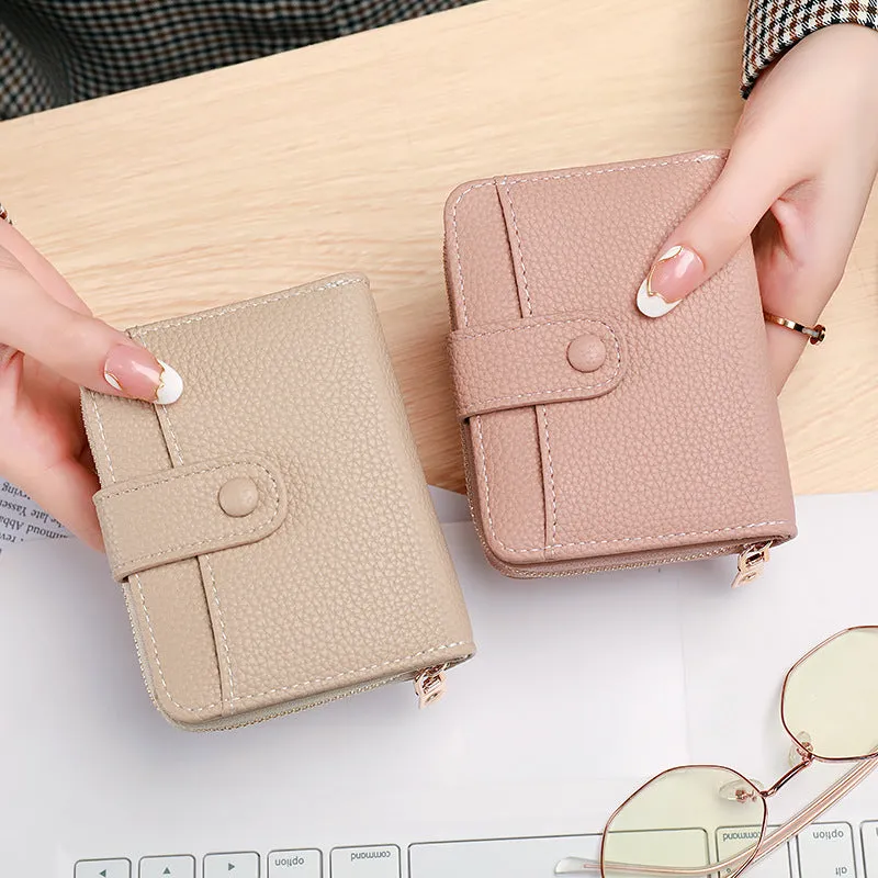 Ladies' short wallet with lychee pattern in pu leather, two-fold compact design