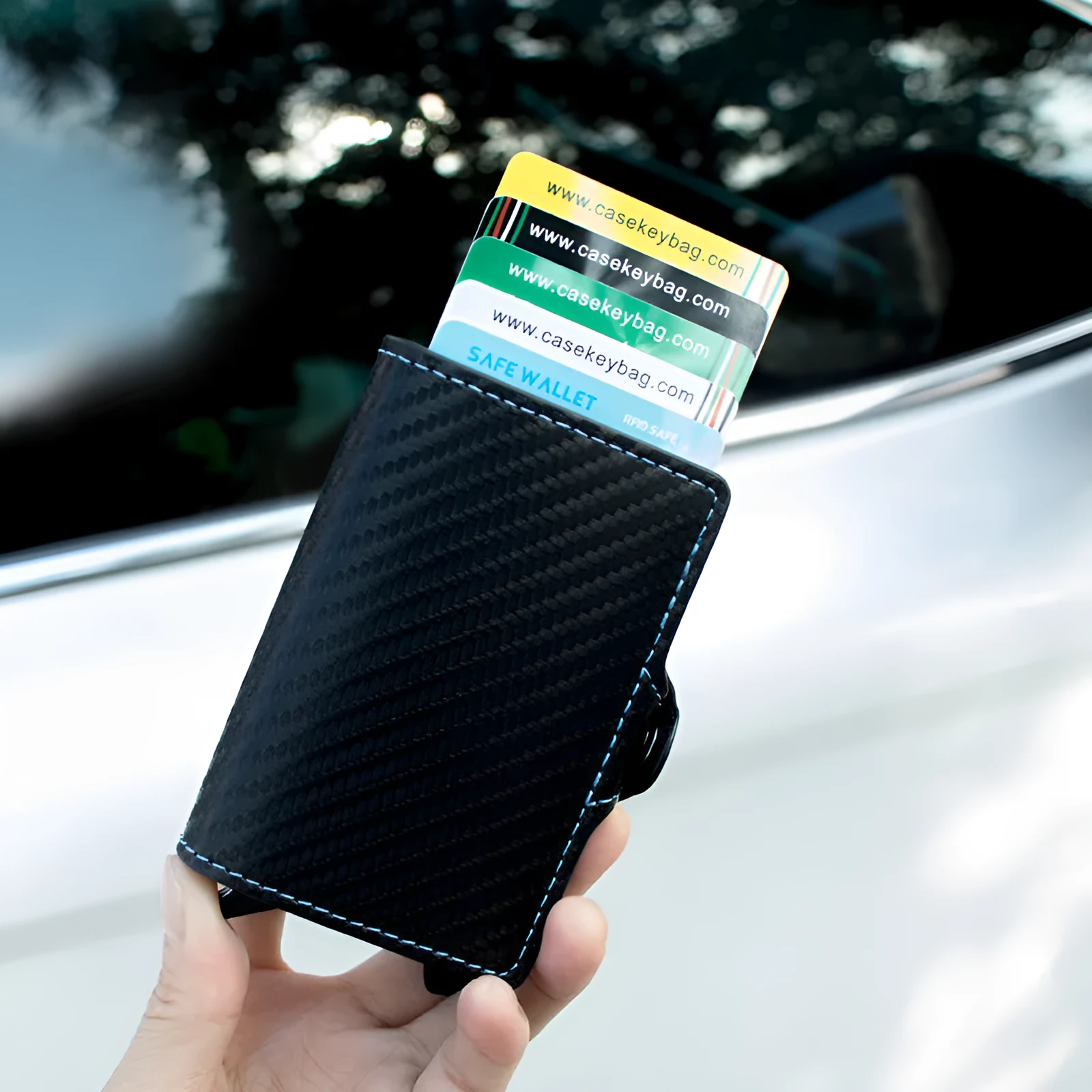 RFID anti-scanning zipper card holder in carbon fibre with plaid pattern and leather trim, showing multiple compartments