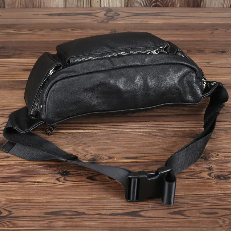 Black cowhide leather messenger bag with large capacity, oval shape, and zipper closure – worn over the shoulder as a crossbody bag