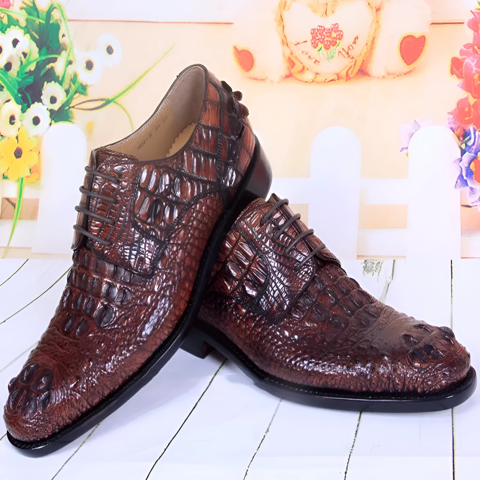 Men's brown crocodile skin leather dress shoes on display, low-top business style