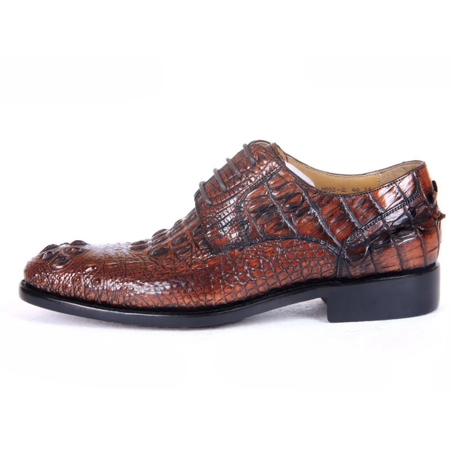 Men's brown crocodile skin leather dress shoes on display, low-top business style