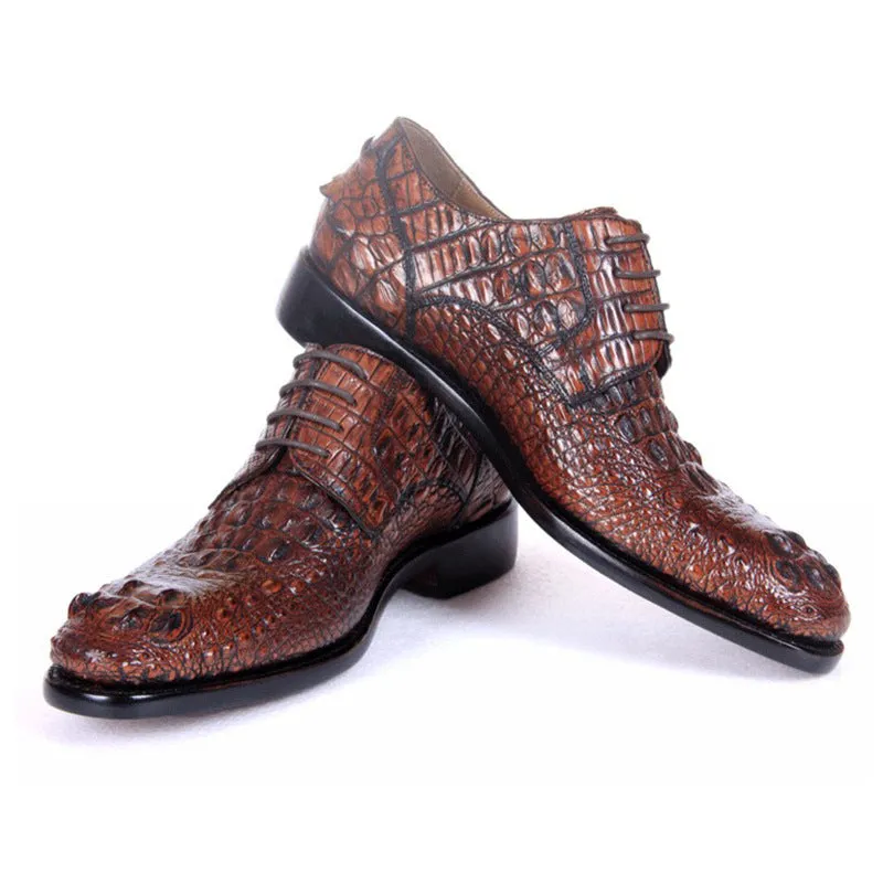 Men's brown crocodile skin leather dress shoes on display, low-top business style