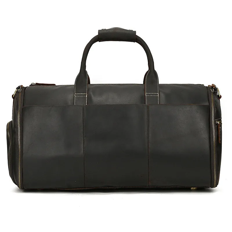 Vintage 22 inch brown leather duffle bag made from top layer cowhide, folding design with zipper closure on plain background