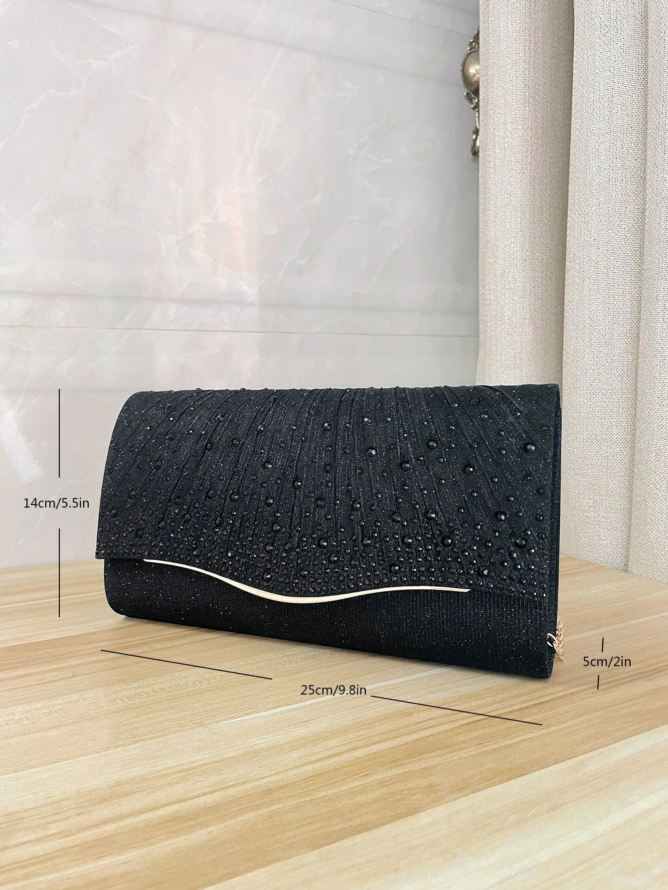 Women's dinner clutch bag in woven fabric with rhinestone dress garment design, available in black, champagne, and silver