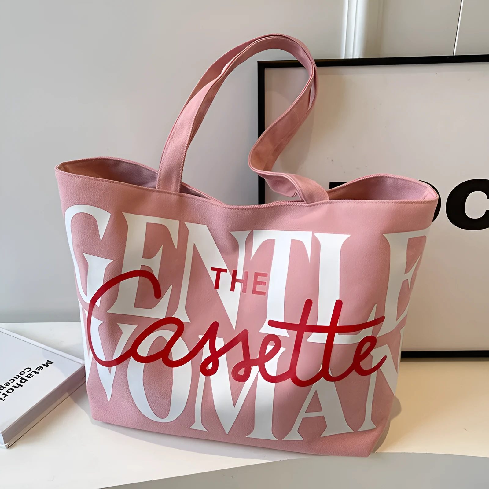 Canvas tote bag with letter print and car stitching detail in medium size 40x7x32cm available in black