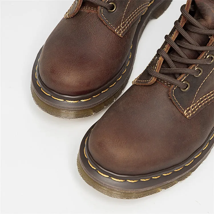 Crazy Horse leather Martin boots with round toe, wedge heel, and front lace-up closure on a white background