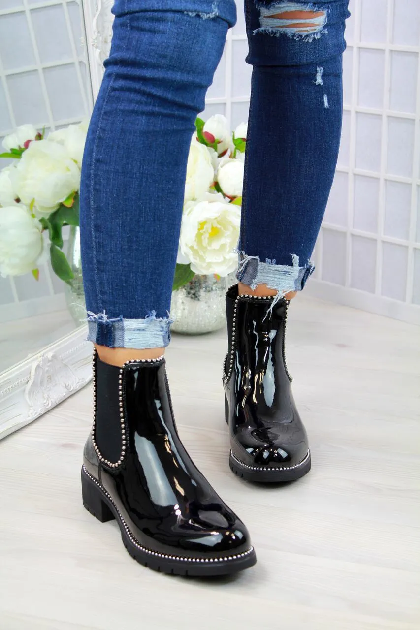 Women's short Martin boots in black PU sheep pattern with round toe and rubber sole