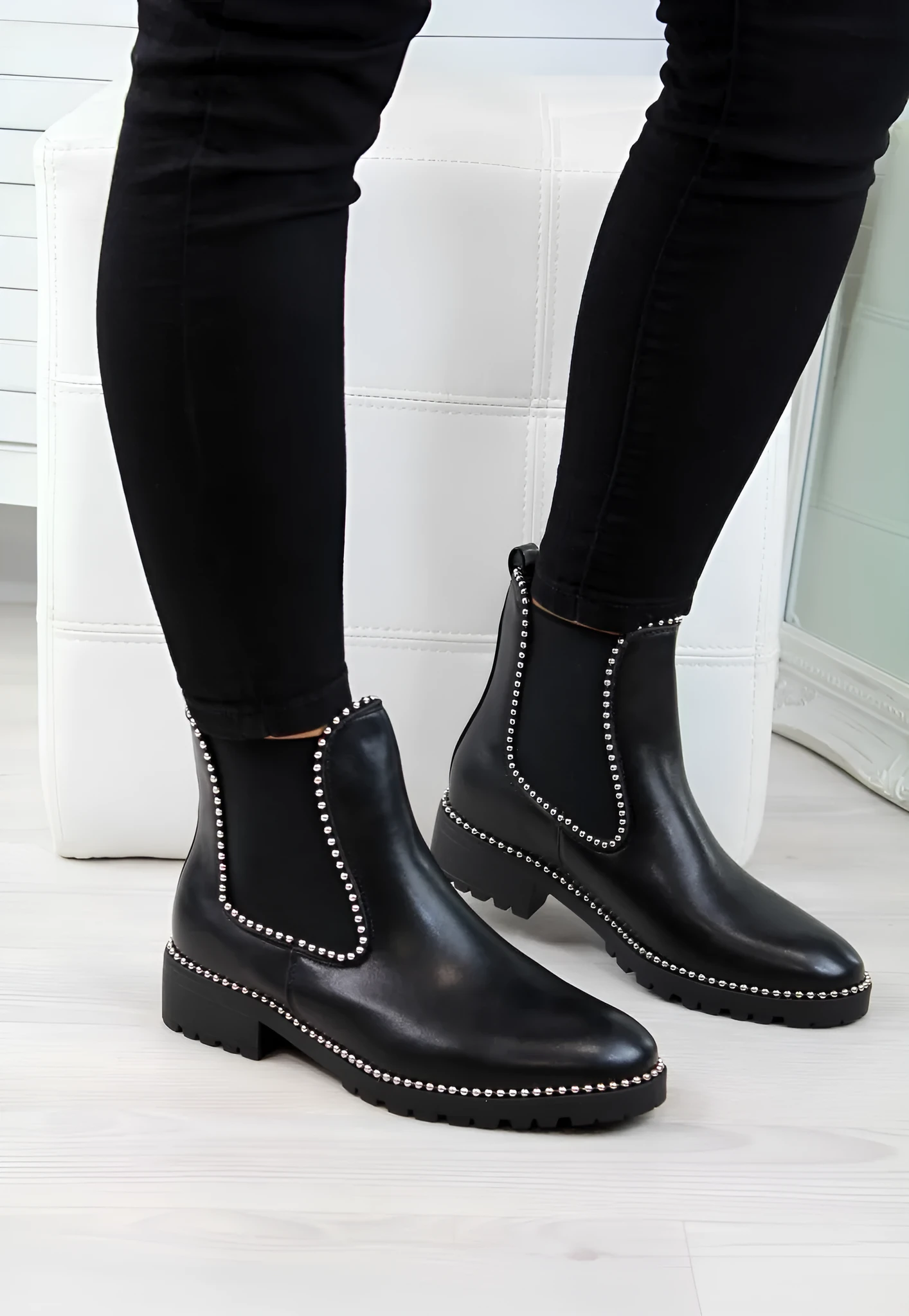 Women's short Martin boots in black PU sheep pattern with round toe and rubber sole