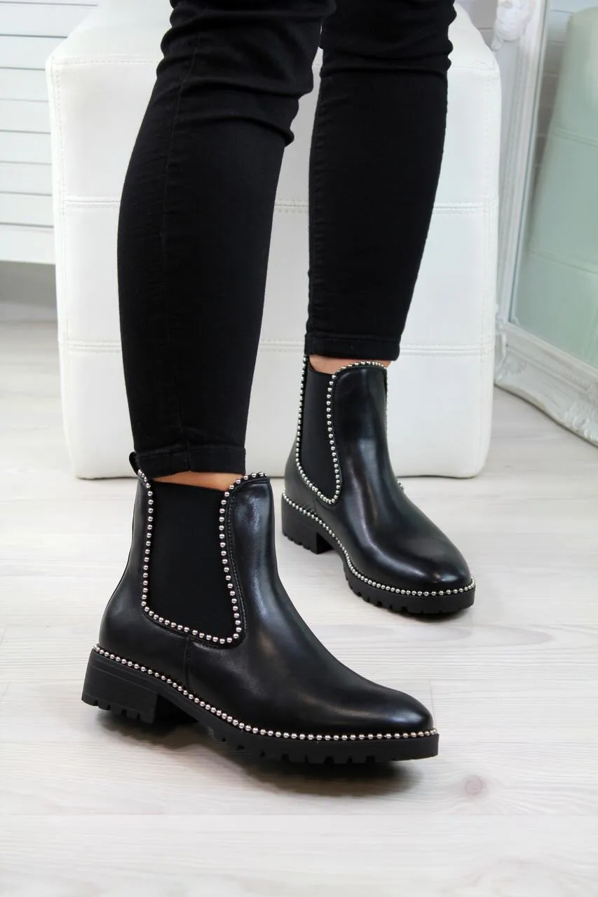 Women's short Martin boots in black PU sheep pattern with round toe and rubber sole