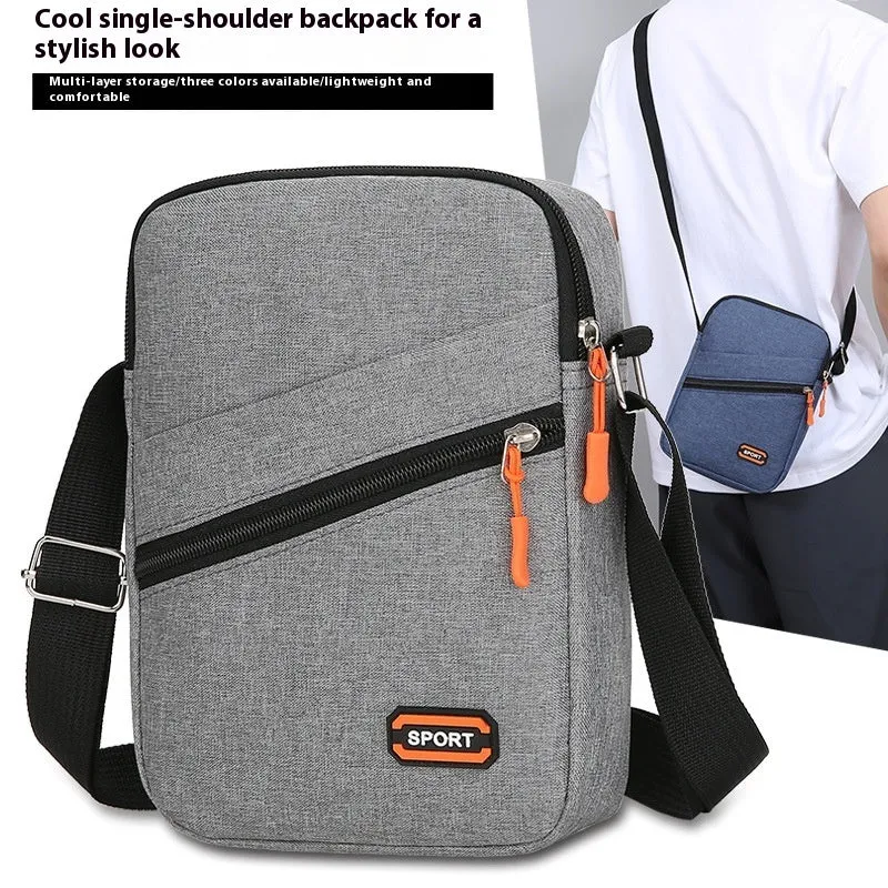 Solid colour Oxford cloth commuter bag with contrast stitching, shown with crossbody strap.