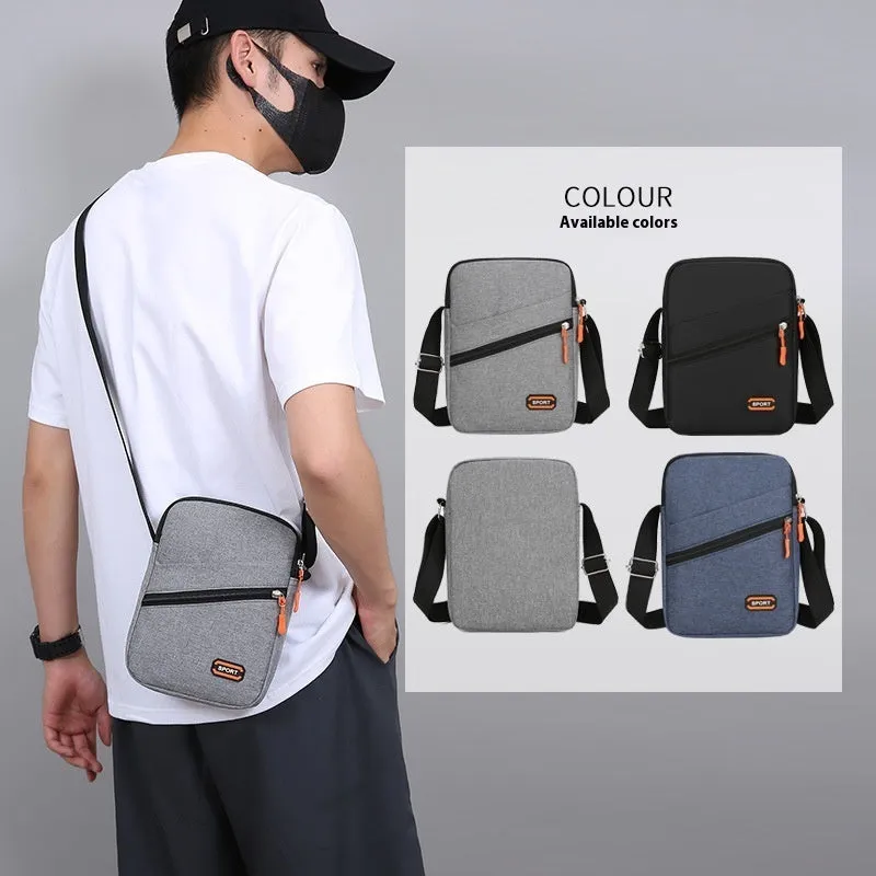 Solid colour Oxford cloth commuter bag with contrast stitching, shown with crossbody strap.