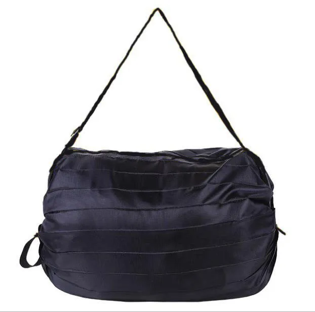 Foldable large-capacity shopping bag in 210d Oxford cloth with pink camouflage colour, hanging on a wall hook