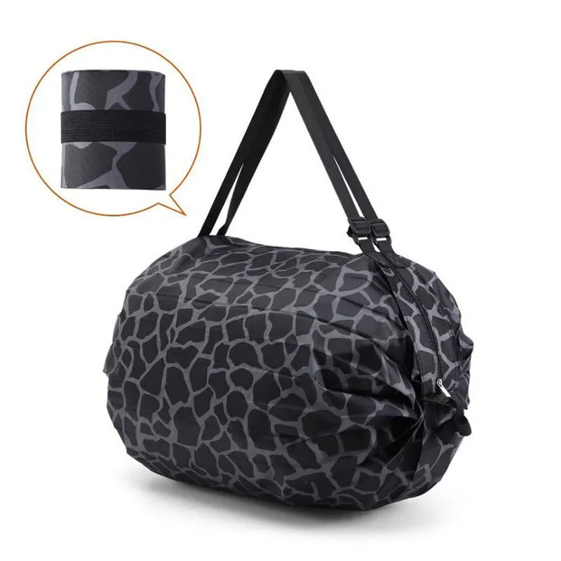 Foldable large-capacity shopping bag in 210d Oxford cloth with pink camouflage colour, hanging on a wall hook