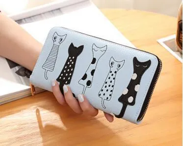 Women's fashion wallet in light green with zip-around closure and card slots