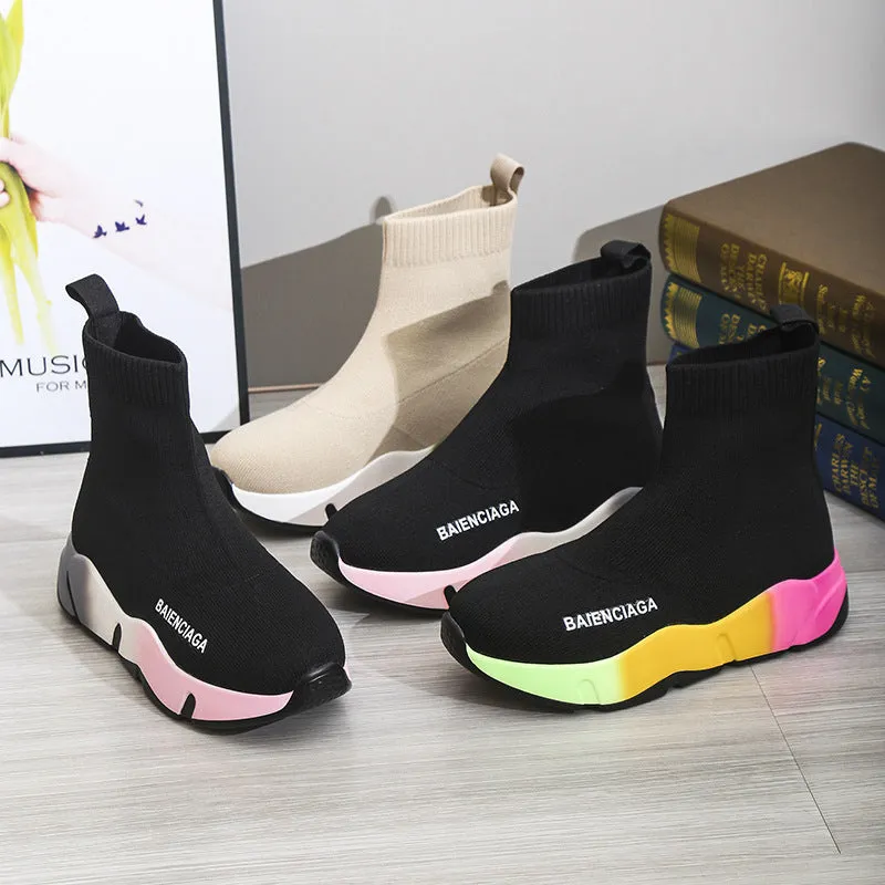 Women's black platform sock boots with cloth upper, rubber sole, round toe, thick heel, and low tube design on a neutral background