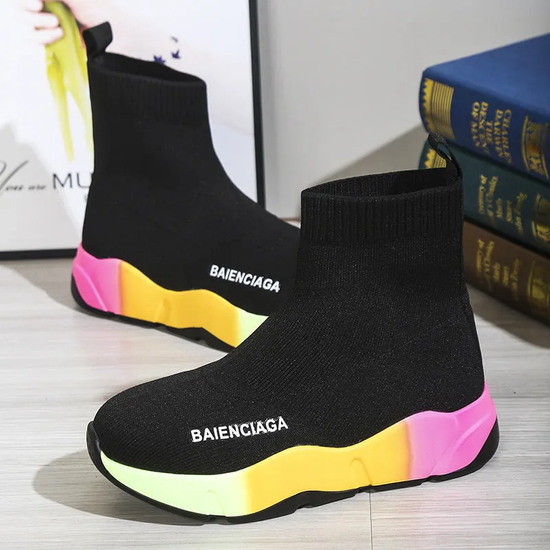 Women's black platform sock boots with cloth upper, rubber sole, round toe, thick heel, and low tube design on a neutral background