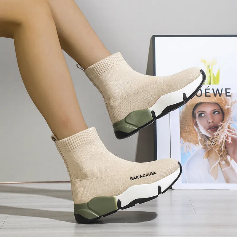 Women's black platform sock boots with cloth upper, rubber sole, round toe, thick heel, and low tube design on a neutral background