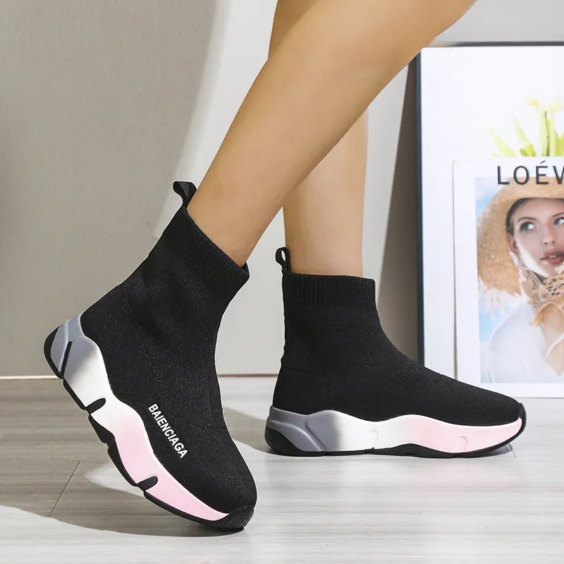 Women's black platform sock boots with cloth upper, rubber sole, round toe, thick heel, and low tube design on a neutral background