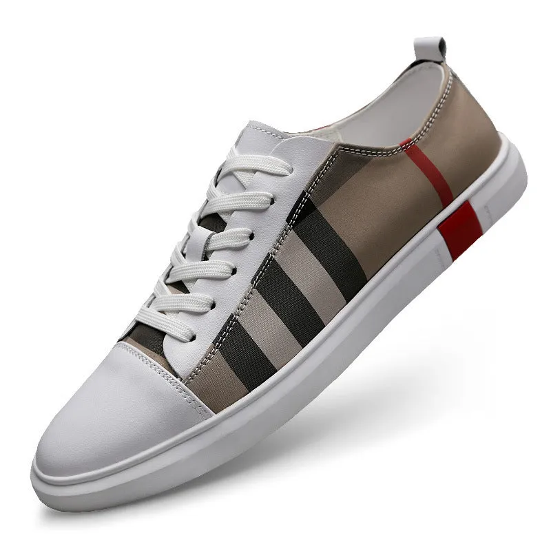 White Korean style breathable leather sneakers for men, round toe with car suture and grid pattern, on a plain background