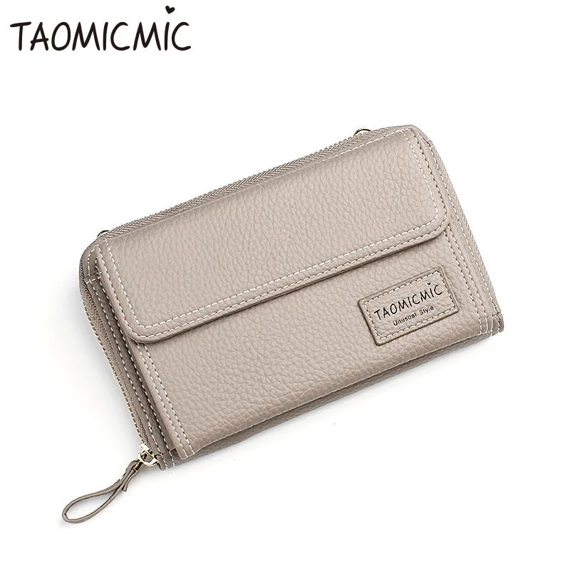 Women's shoulder bag in blackish green with adjustable strap and zipper closure, polyester material, on neutral background