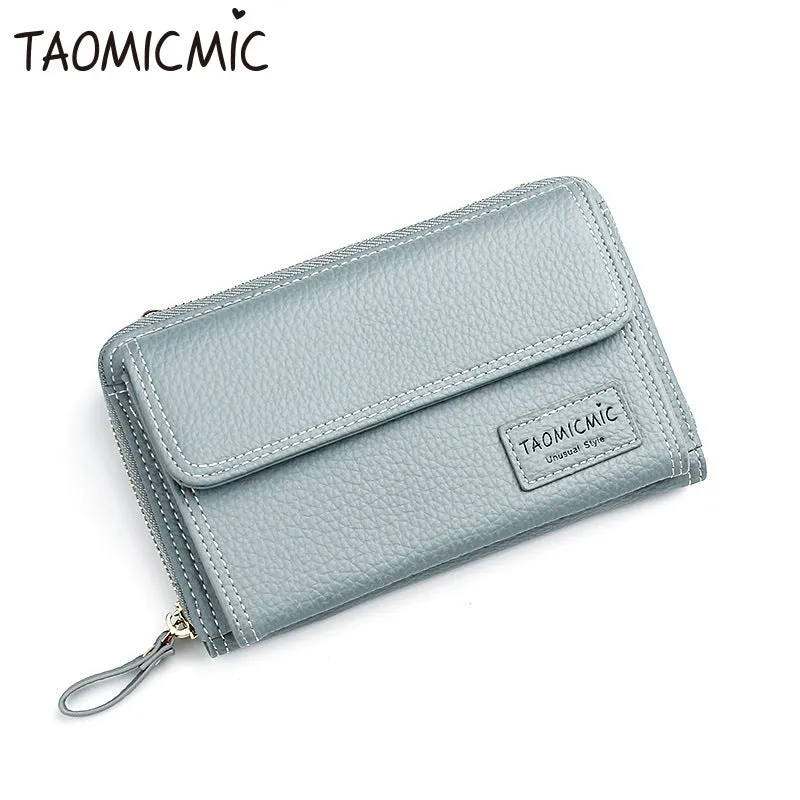 Women's shoulder bag in blackish green with adjustable strap and zipper closure, polyester material, on neutral background