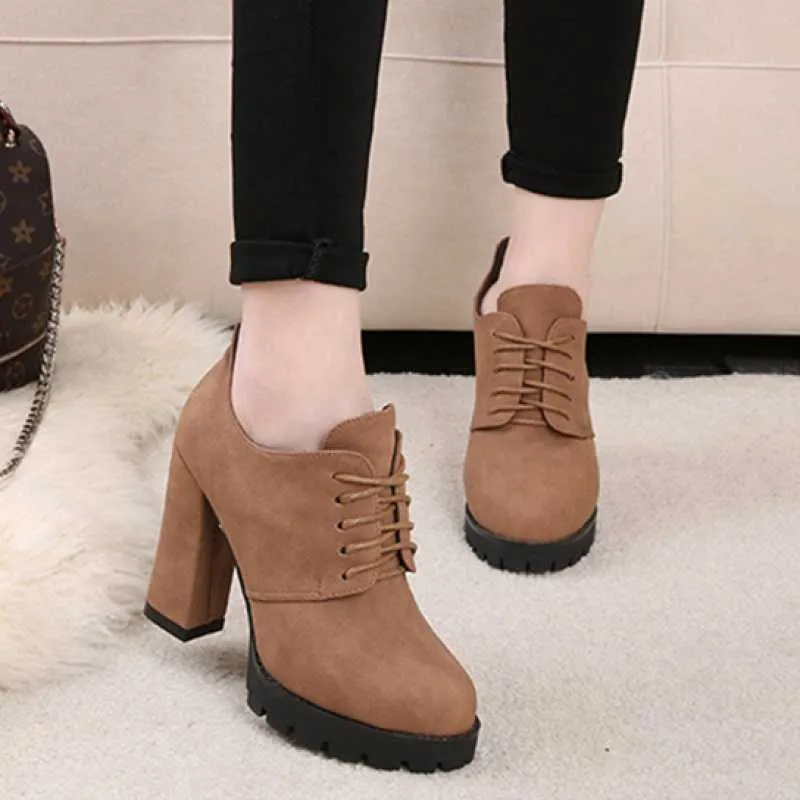 Women's black platform boots with thick heel, PU upper, lace-up front, and round toe