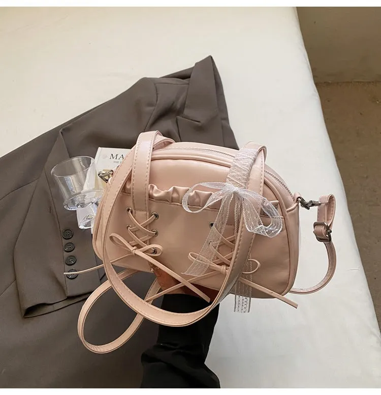 Women's casual PU shoulder handbag with a large bandage bow detail and phone compartment.