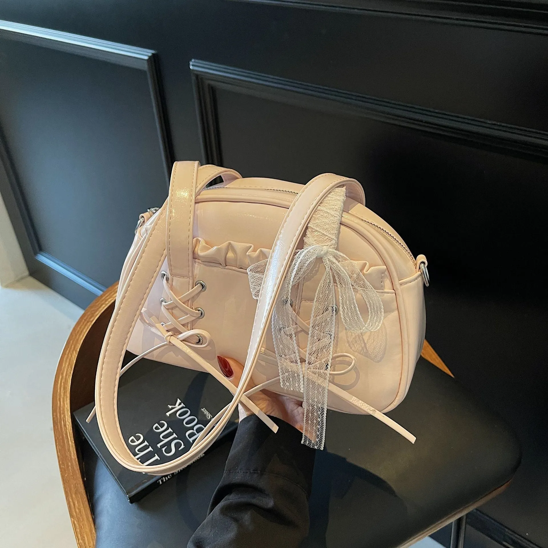 Women's casual PU shoulder handbag with a large bandage bow detail and phone compartment.