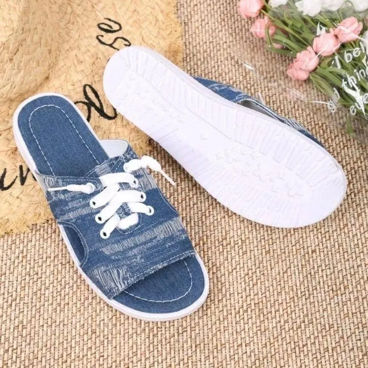Blue women's Roman-style flat canvas slippers with a cloth upper and rubber sole.