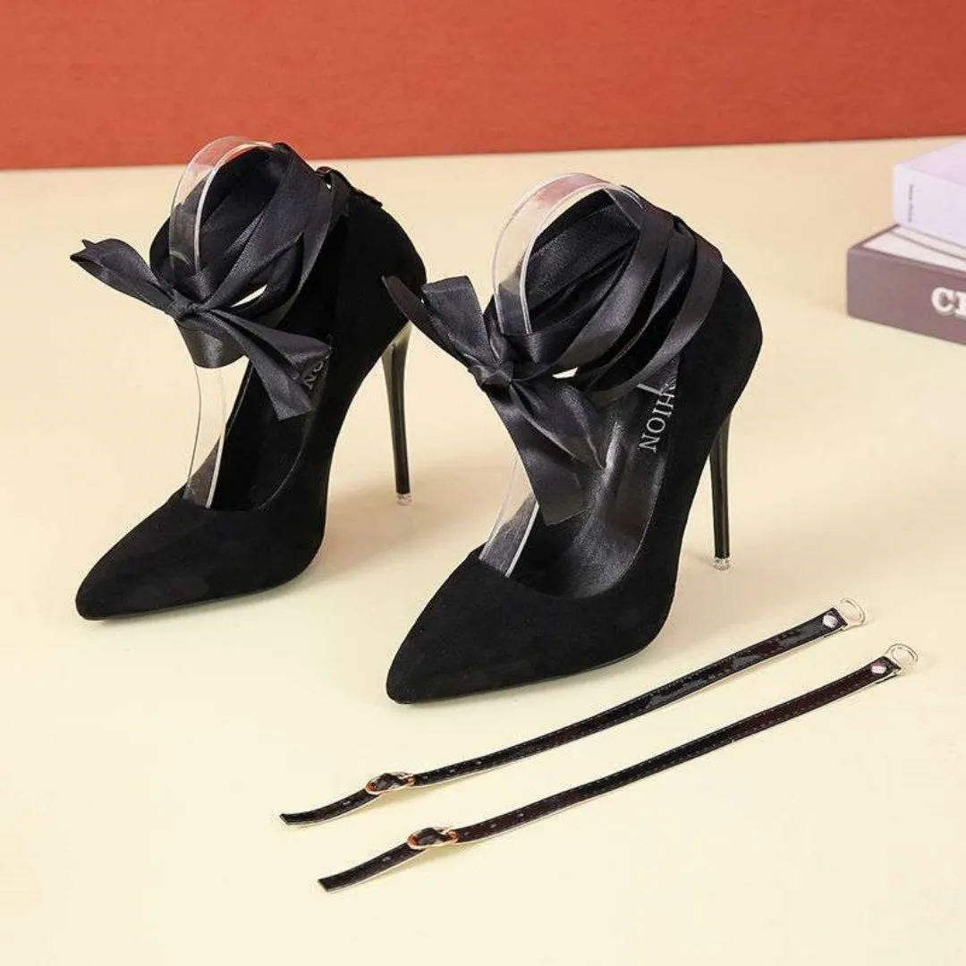 Women's black platform court shoe with pointed toe and lace ankle strap on a 12cm heel.