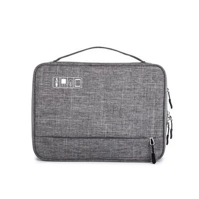 Cube-shaped polyester digital storage bag in black with zippered opening for cables and gadgets