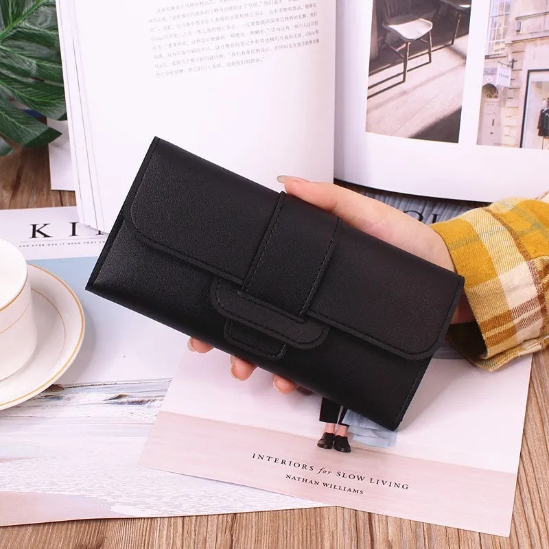 Women's long tri-fold wallet in light grey PU leather with sewing thread detail, open to show multiple card slots and cash compartments.