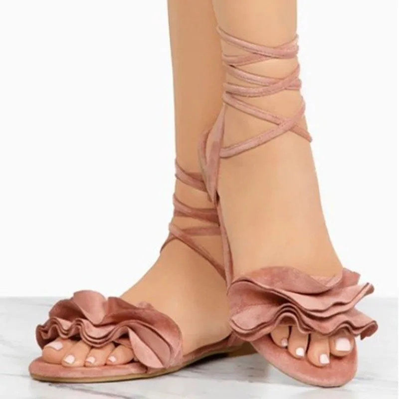 Women's plus size suede flower flat sandals with ankle strap in black, side view