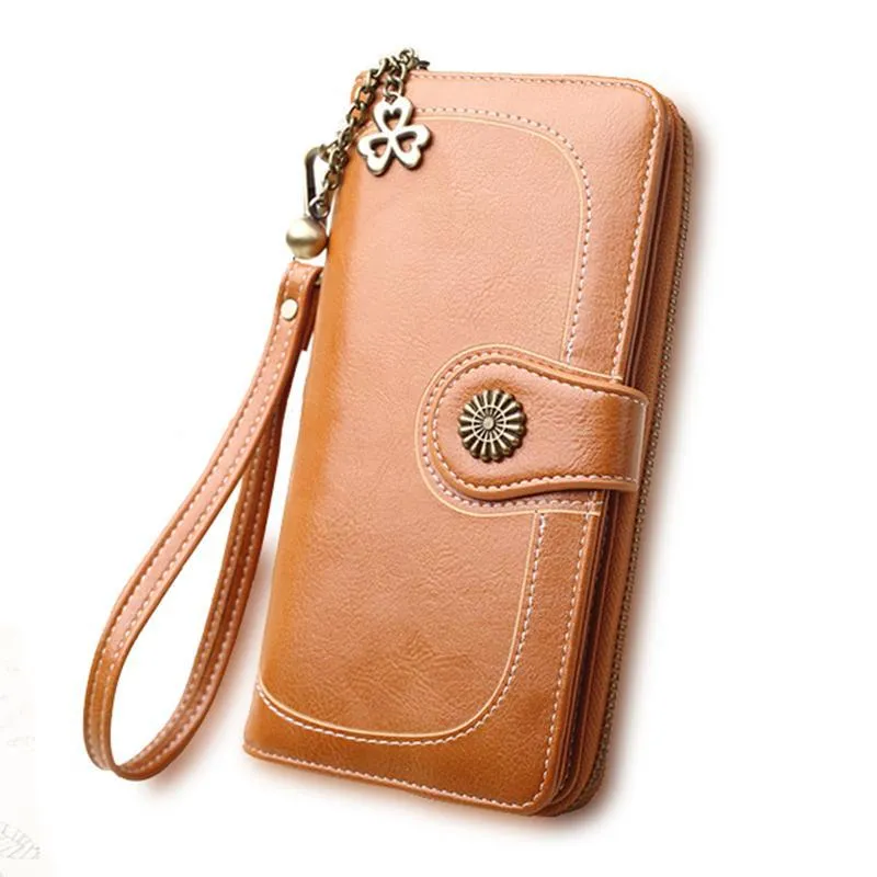 Split leather long wallet for women in black, folded with zip closure and multiple card slots visible