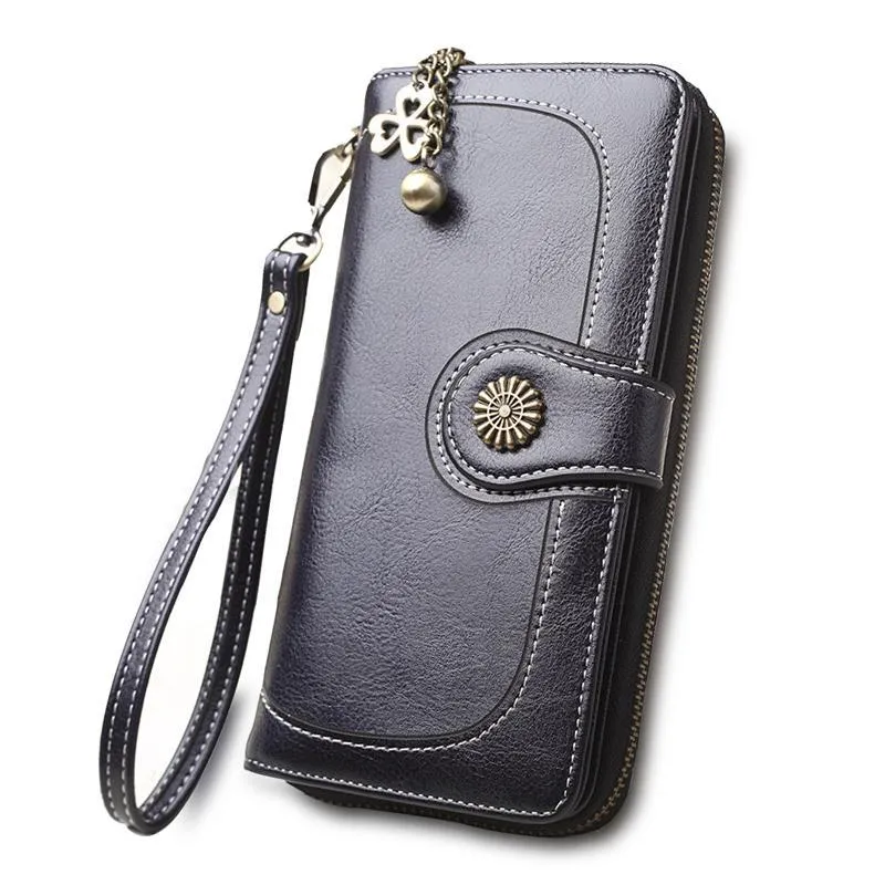 Split leather long wallet for women in black, folded with zip closure and multiple card slots visible
