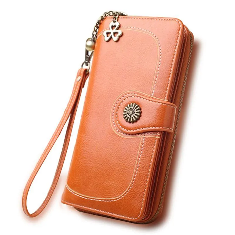 Split leather long wallet for women in black, folded with zip closure and multiple card slots visible
