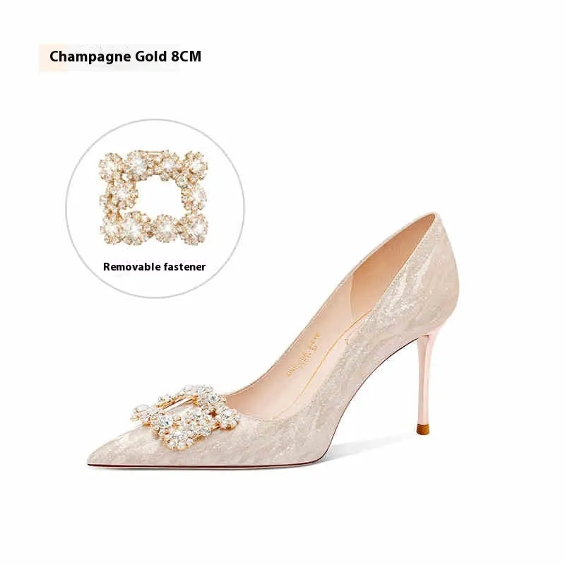 Champagne gold pointed-toe stiletto pumps with rhinestone details on the heel.