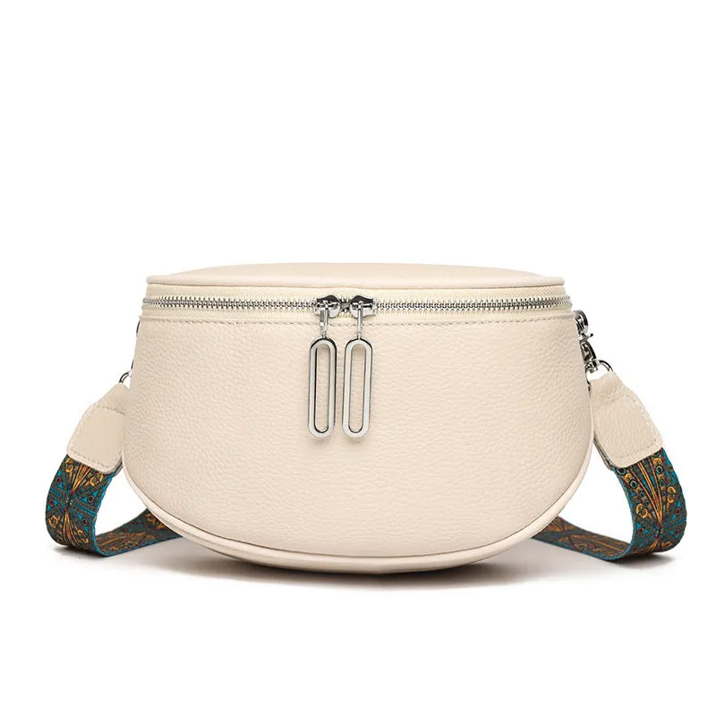 Women's saddle-shaped messenger bag in soft PU leather with cross-body strap and zippered compartment