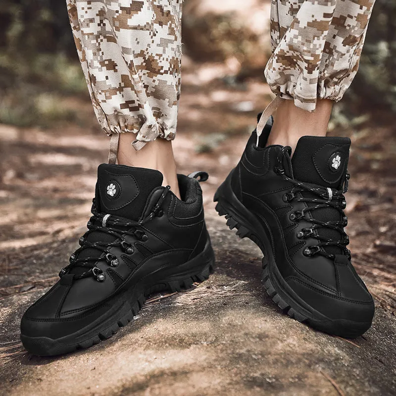 Men's military-style hiking boots in black with PU upper and rubber sole, shown on outdoor ground.