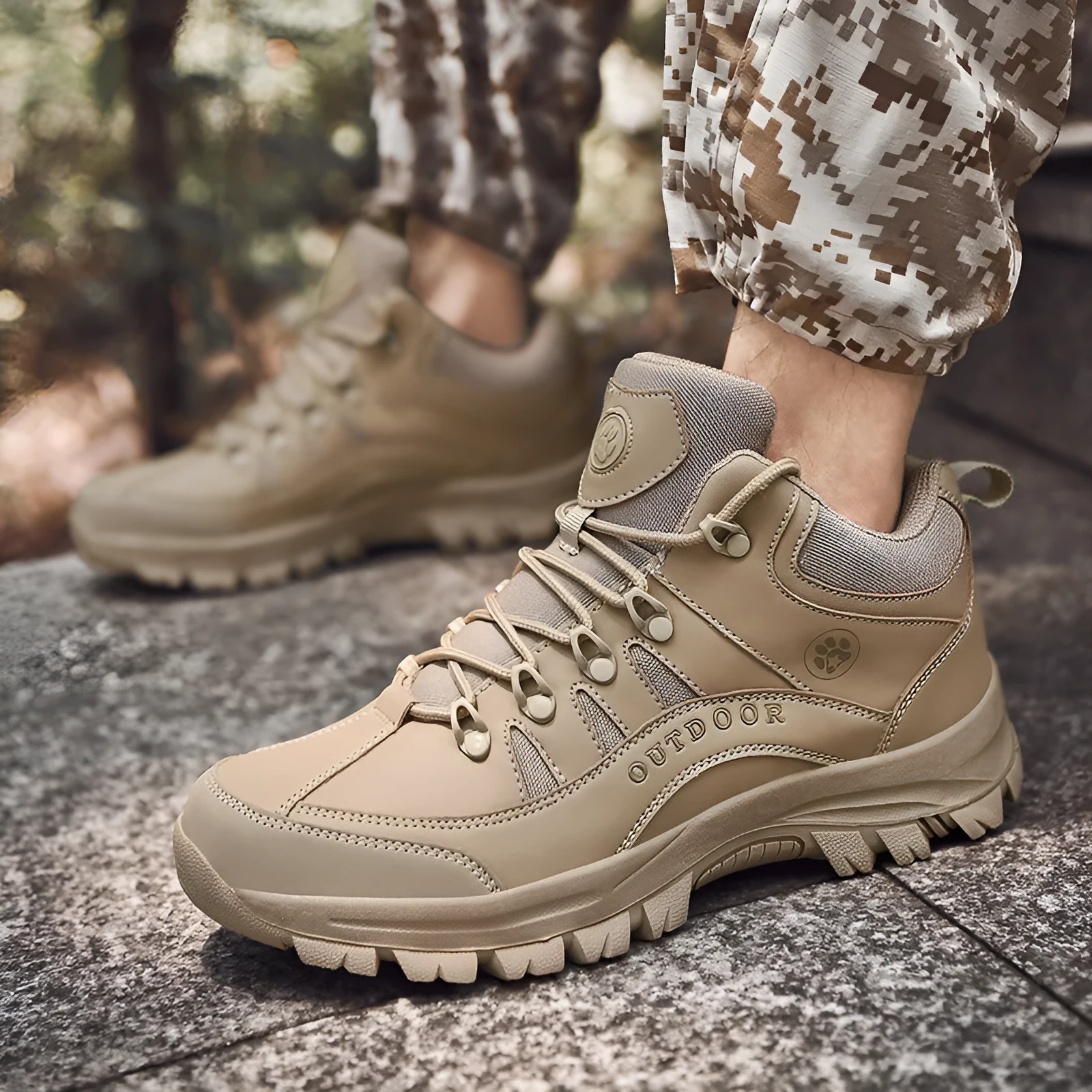 Men's military-style hiking boots in black with PU upper and rubber sole, shown on outdoor ground.