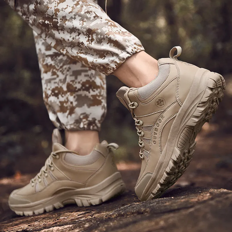 Men's military-style hiking boots in black with PU upper and rubber sole, shown on outdoor ground.