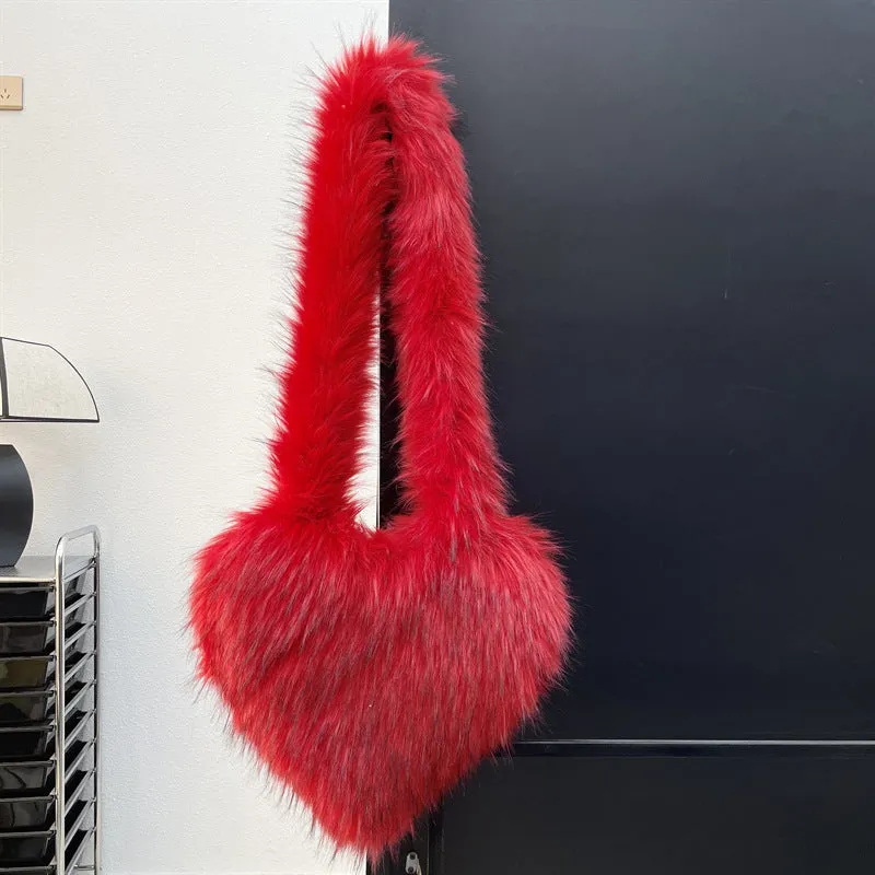 Women winter fleece heart shape crossbody bag with plush exterior, tassel detail, and large capacity