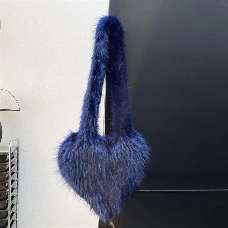 Women winter fleece heart shape crossbody bag with plush exterior, tassel detail, and large capacity