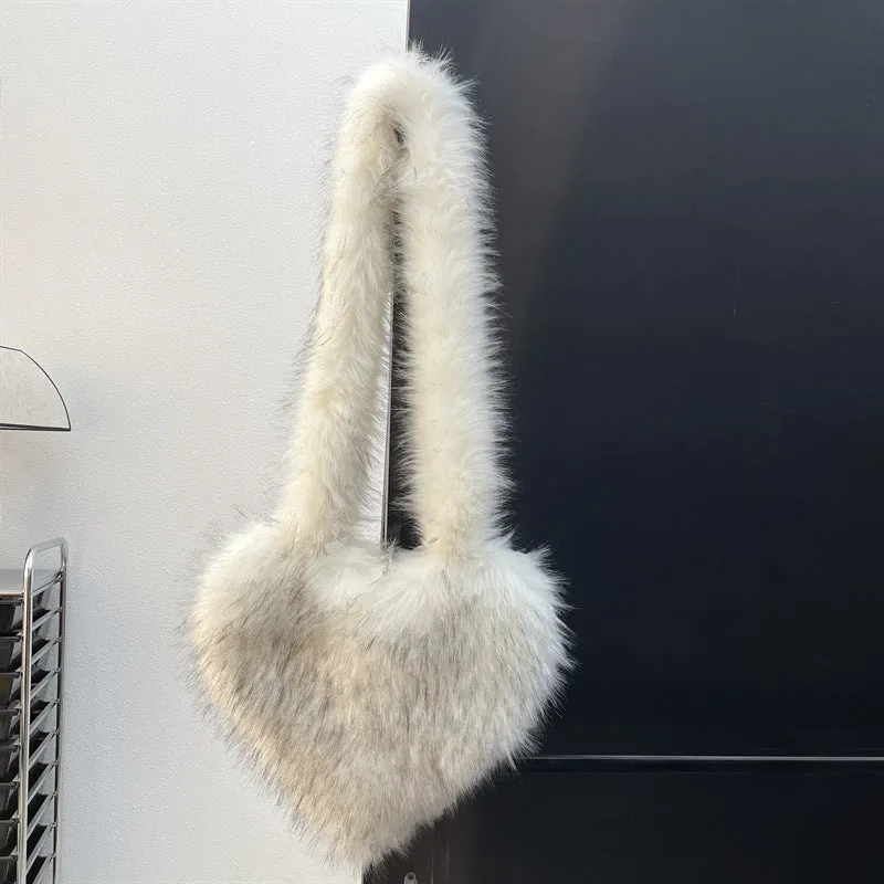 Women winter fleece heart shape crossbody bag with plush exterior, tassel detail, and large capacity